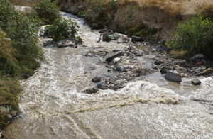 The polluted Kidron/Nar, as it flows by Al-Ubeidyeh, West Bank.